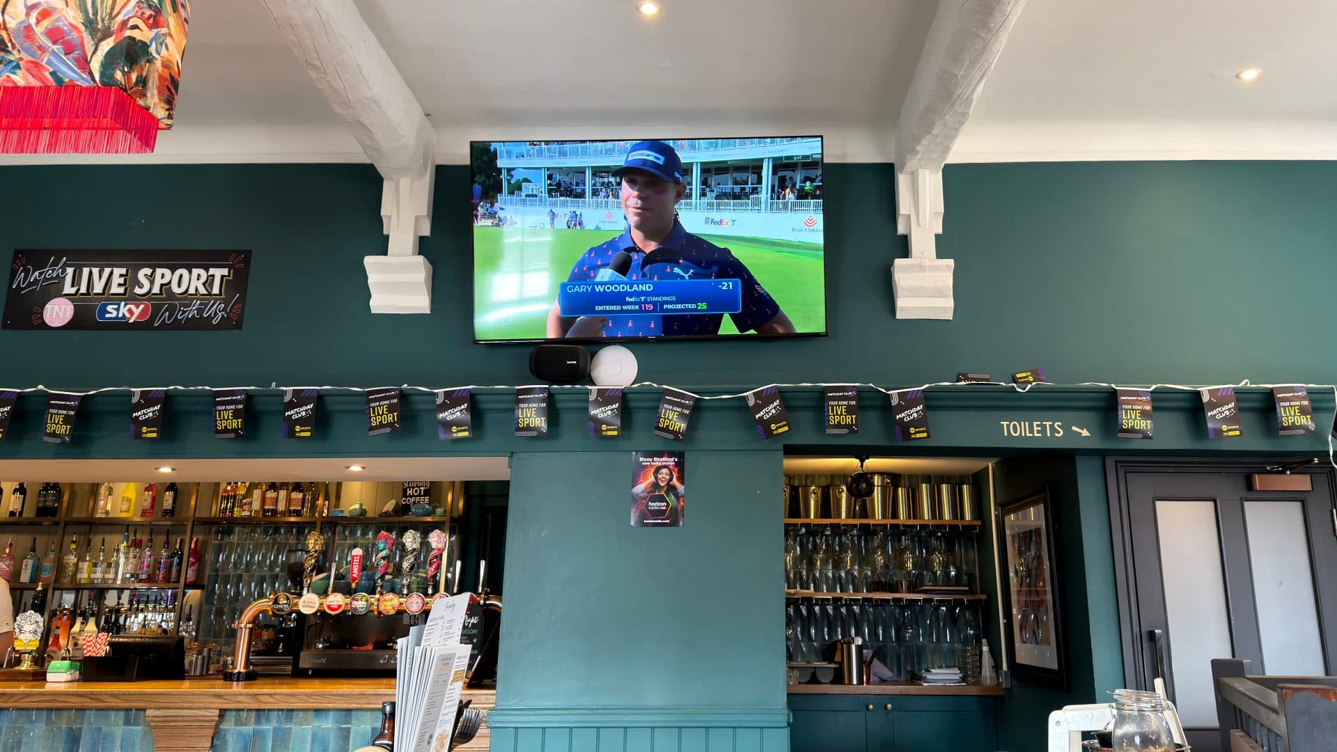 Large-screen live sport setup inside The Old School House pub in Stony Stratford.